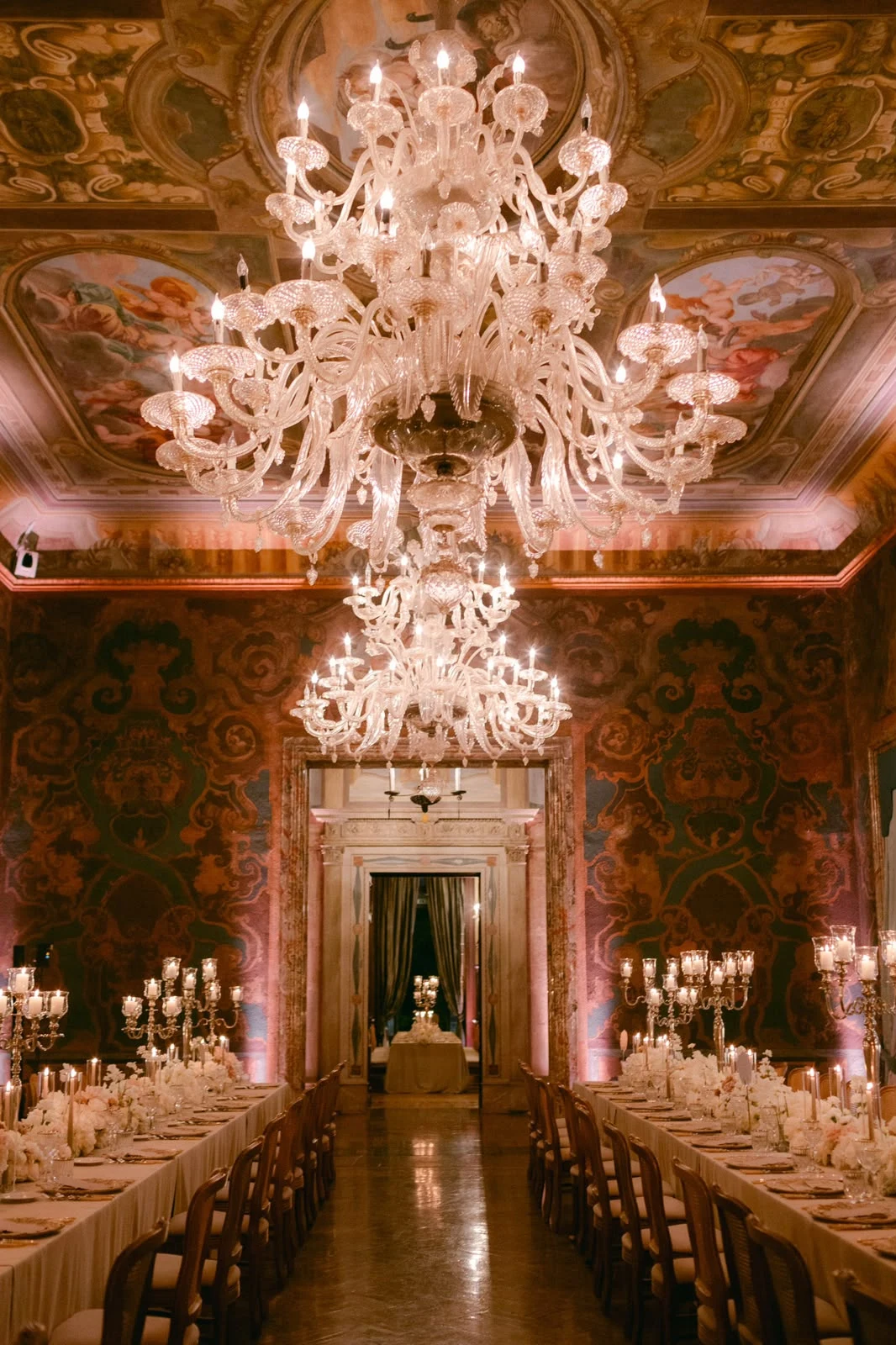 Candlelit reception in an ornate hall